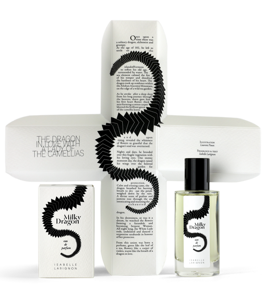 Milky Dragon by Isabelle Larignon — the 50ml bottle beside its illustrated box, opened out to show the cross-shaped interior printed with the dragon and the Lady of the Camellias.